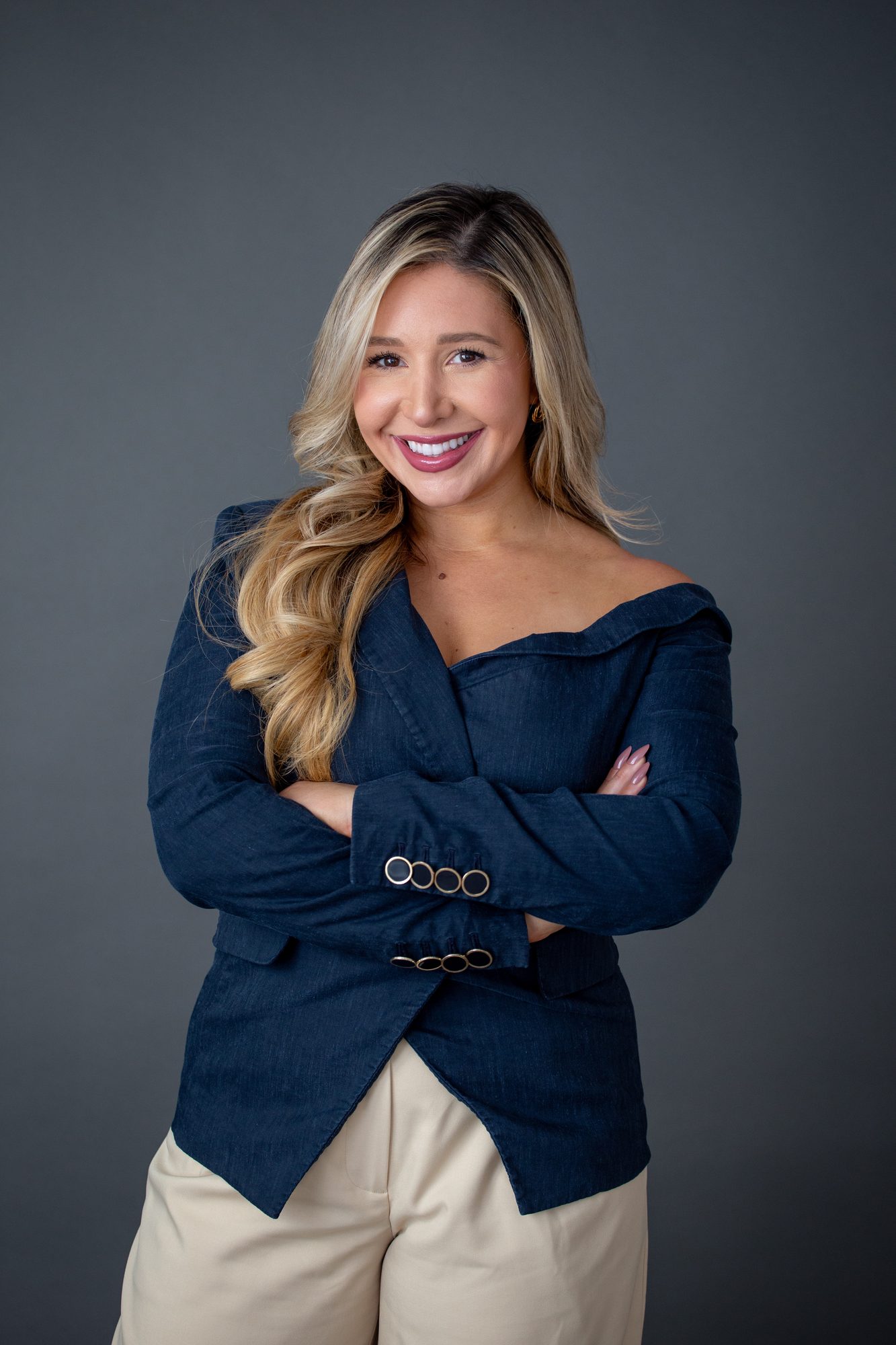 Laura Davis, co-founder of USLege and AI for government affairs speaker, in a navy blazer.