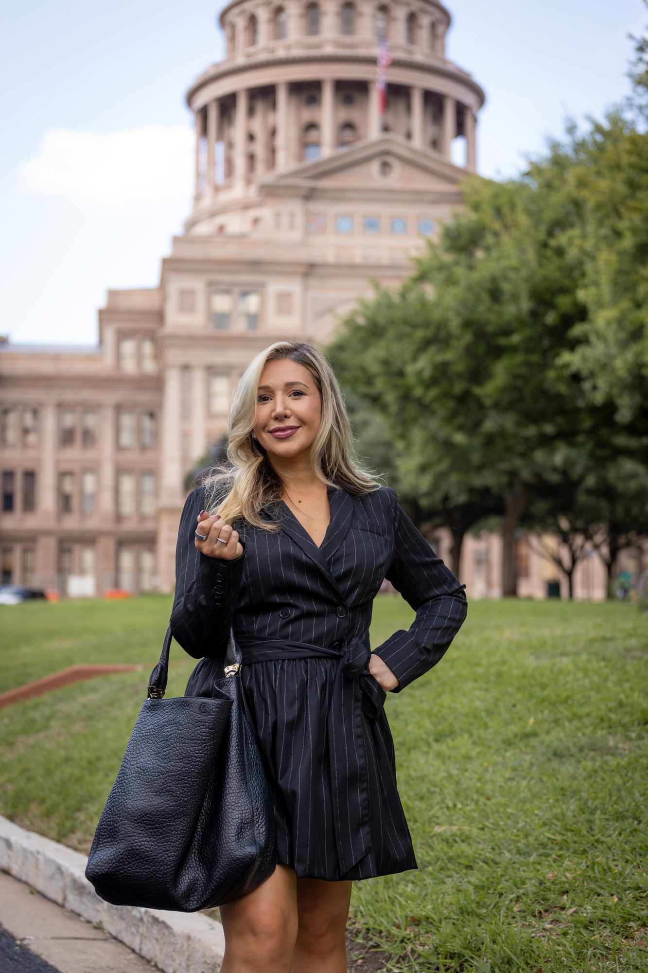 Laura Davis, former Texas Senate Policy Director, in front of the Texas State Capitol in Austin.
